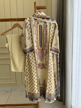 Muslin Stitched Suit featuring aari work details