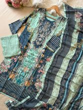 Muslin Stitched Suit featuring aari work detailings