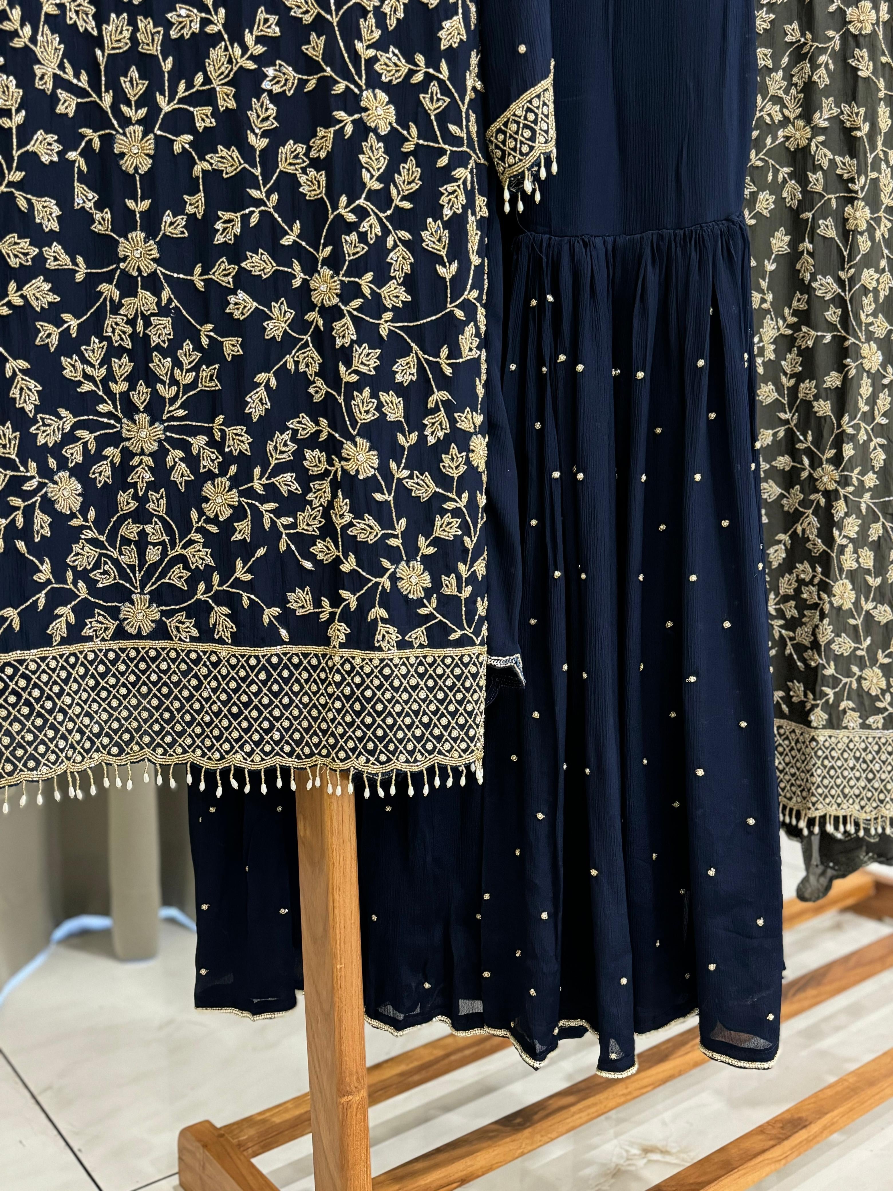 Heavy hand-worked suit with wide sharara