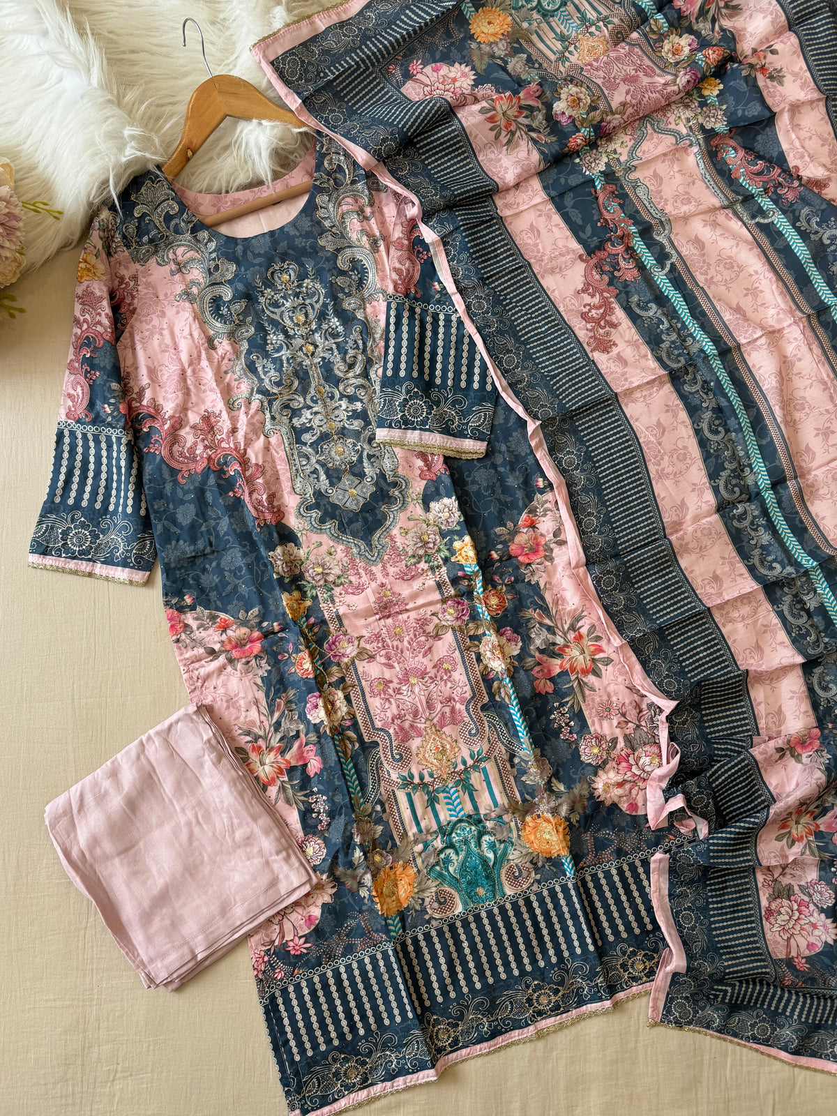 Muslin Stitched Suit featuring aari work detailings