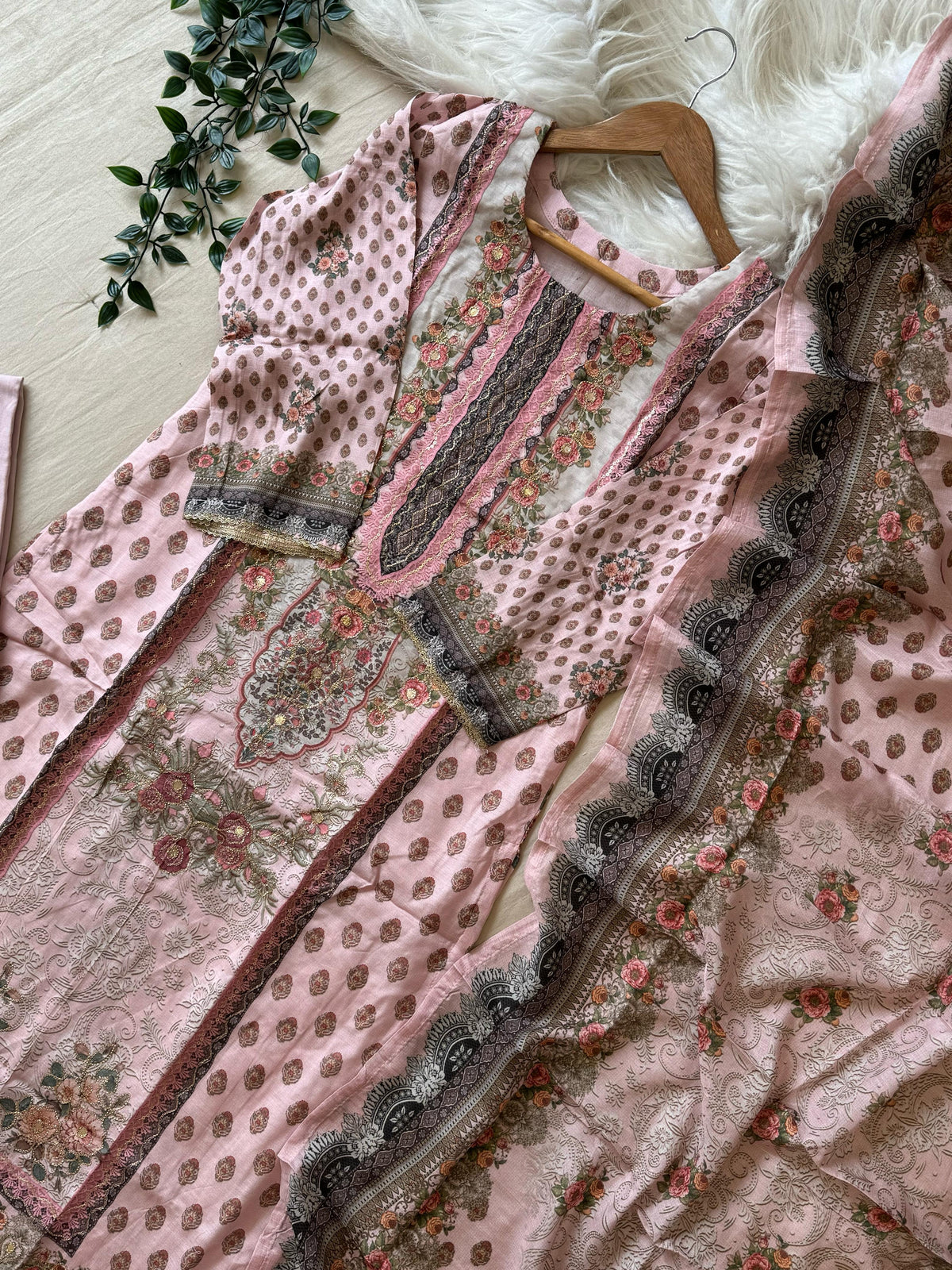 Muslin Stitched Suit featuring aari work details